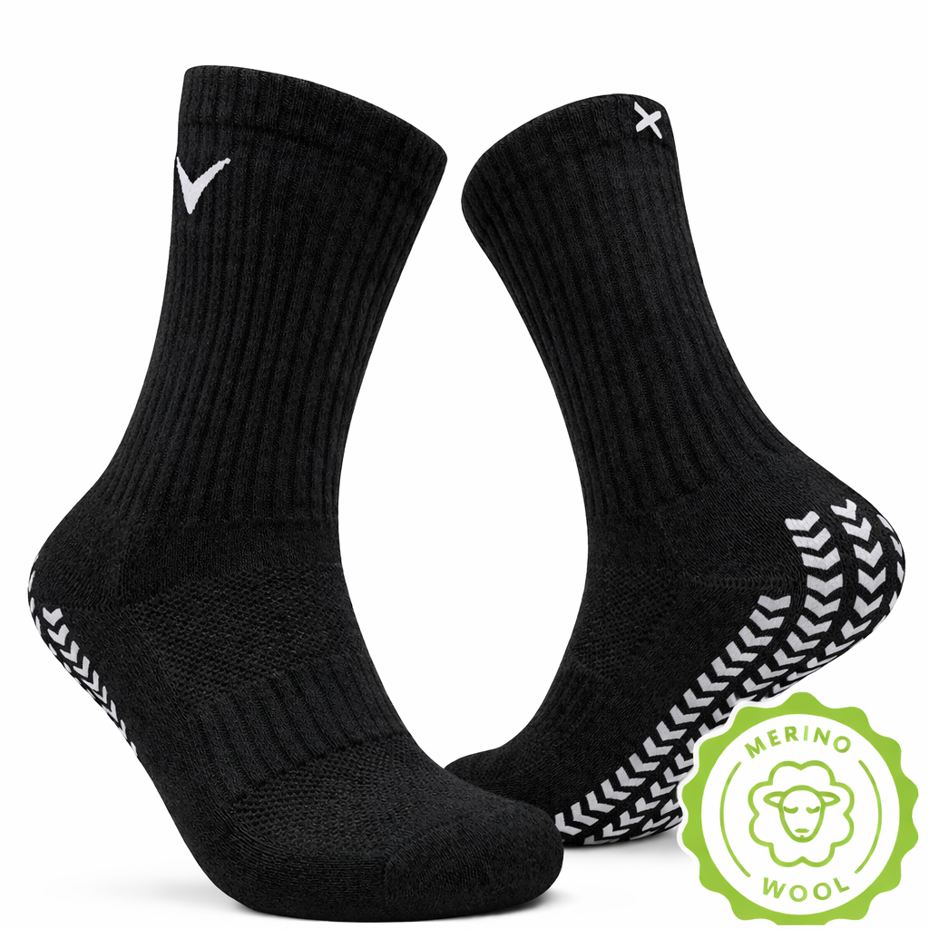 Svart EliteX™ Merino Ull Gripsokker med anti-skli mønster under foten, laget av myk og varm merinoull for optimal komfort og godt grep under aktivitet.