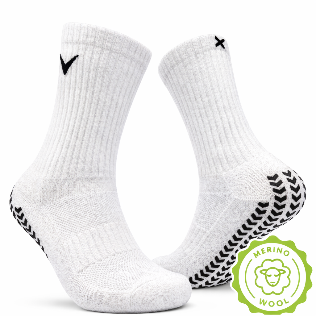 EliteX™ Merino Ull Gripsokker i hvit, med grep under sålen for bedre feste og komfort under aktivitet, laget av myk merinoull for optimal varme og pusteevne.