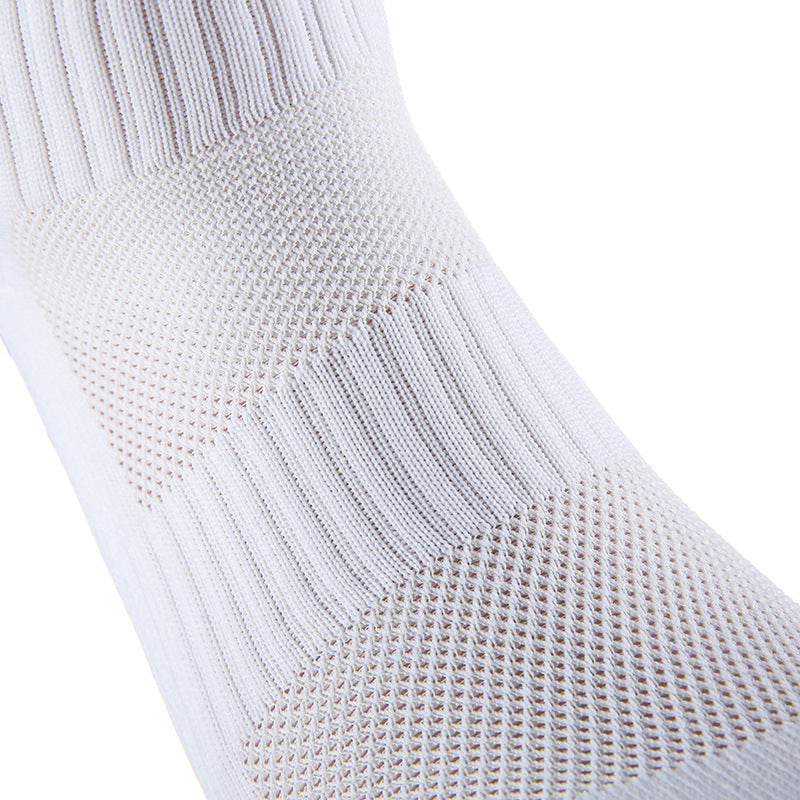 Nærbilde av hvit EliteX gripsokk som viser ventilert mesh-strikk og forsterket tåparti i premium kvalitet.