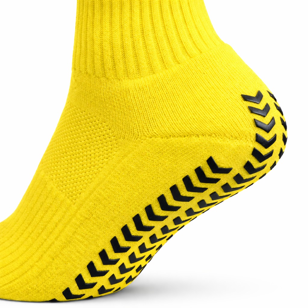 EliteX™ Gripsokker – Gul med sklisikre gummimønstre under foten, designet for bedre grep og komfort ved fotball og annen aktivitet.
