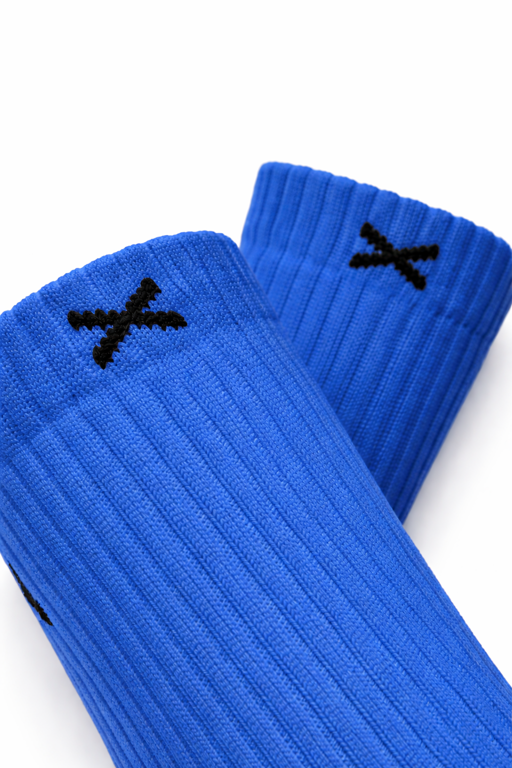Nærbilde av EliteX™ Gripsokker – Blå med ribbestrikket struktur og svart logo, designet for fotballspillere som trenger grip og komfort i trenings- og kampforhold.